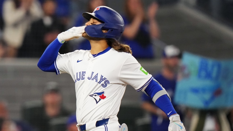 Toronto Blue Jays' Bo Bichette (11) celebrates his two-run home run against the Seattle Mariners during third inning American League MLB baseball action in Toronto on Tuesday, April 9, 2024. THE CANADIAN PRESS/Chris Young