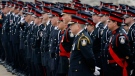 Thousands of law enforcement officers gather for the funeral of Ontario Provincial Police Officer Vu Pham in Wingham, Ont., on Friday, March 12, 2010. (Dave Chidley / THE CANADIAN PRESS)