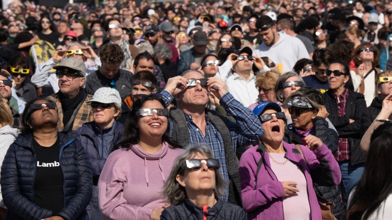 Thousands of people flocked to watch the total solar eclipse at Parc Jean Drapeau, in Montreal, Monday, April 8, 2024. (Ryan Remiorz, The Canadian Press)