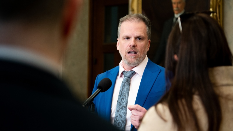Mark Holland, Minister of Health, speaks to reporters in the Foyer of the House of Commons on Parliament Hill in Ottawa, on Wednesday, March 20, 2024. (THE CANADIAN PRESS/Spencer Colby)