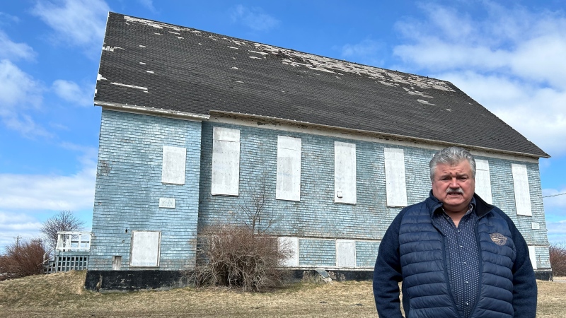 Cape Breton councillor Darren Bruckschwaiger stands in front of an abandoned church in Dominion, N.S. (Source: Ryan MacDonald/CTV News Atlantic) 