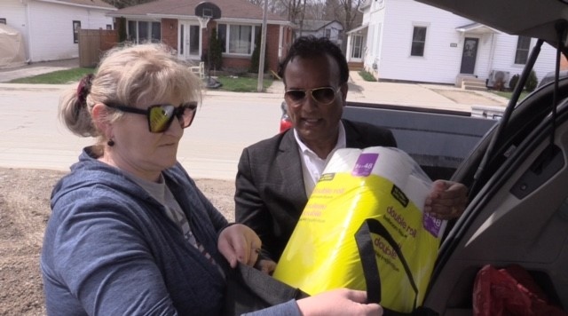 Volunteers with the Multicultural Association of Perth-Huron deliver food in their mobile food bank to those in need in Wingham, Ont. on April 10, 2024. (Scott Miller/CTV News London) 