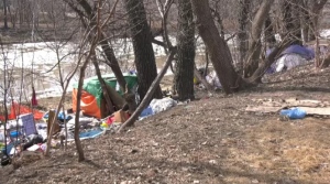 An encampment is set up along the riverbank along Assiniboine Avenue on April 10, 2024. (Jeff Keele/CTV News Winnipeg)