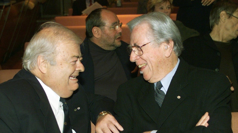 Jazz musician Phil Nimmons, right, has a laugh with Father Fernand Lindsay before a news conference where they were among the recipients of the Governor-General's performing arts awards in Montreal Tuesday, Sept. 24, 2002.(CP PHOTO/Ryan Remiorz