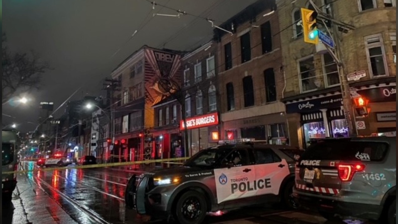 Police respond to a triple shooting at Queen and Portland streets in downtown Toronto Thursday April 11, 2024. (Courtney Heels /CP24)