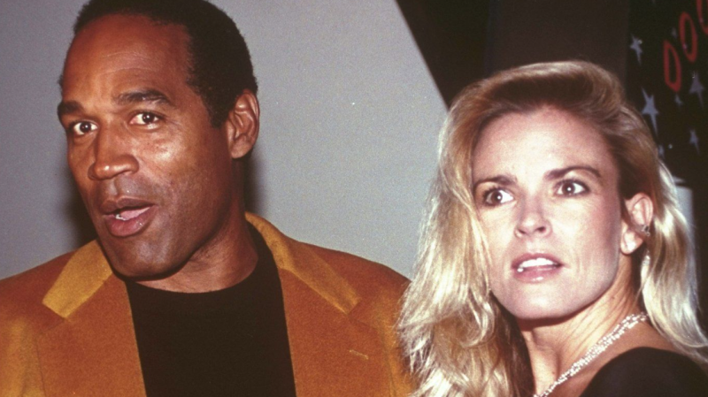 O.J. Simpson and his wife, Nicole Brown Simpson, arrive for the opening of the Harley-Davidson Cafe in New York on Oct. 19, 1993.  (AP Photo/Paul Hurschmann, File)