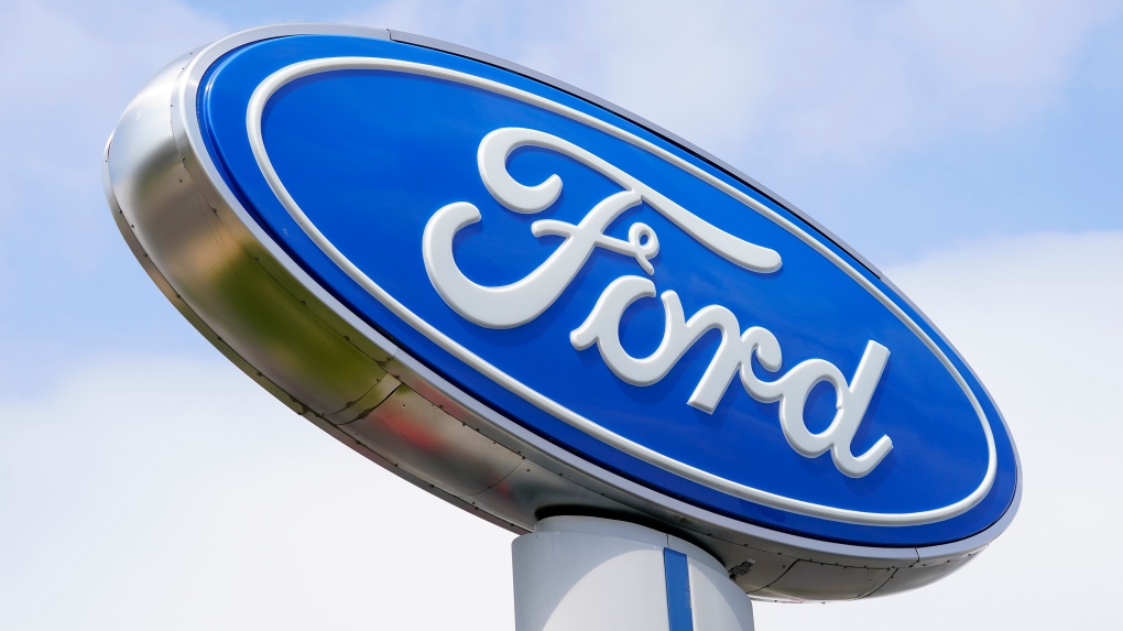 A Ford sign is shown at a dealership 