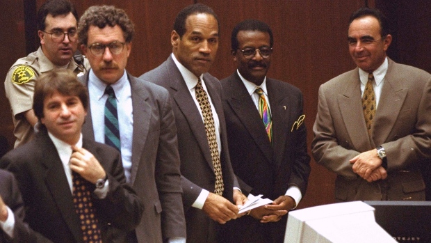 It was one of the most notorious criminal trials in American history. The high-profile proceedings in the '90s, dubbed the 'Trial of the Century,' prosecuting the killings of Nicole Brown Simpson and her friend Ronald Goldman captivated audiences around the world. O.J. Simpson's death has sparked renewed interest in the trial and the fascinating cast of characters who took part.<br><br>
From left to right: Barry Scheck, Peter Neufeld, O.J. Simpson, Johnnie Cochran Jr., and Robert Shapiro. Background is Deputy Guy Magnera. <br><br>
(AP Photo/Reed Saxon, Pool)