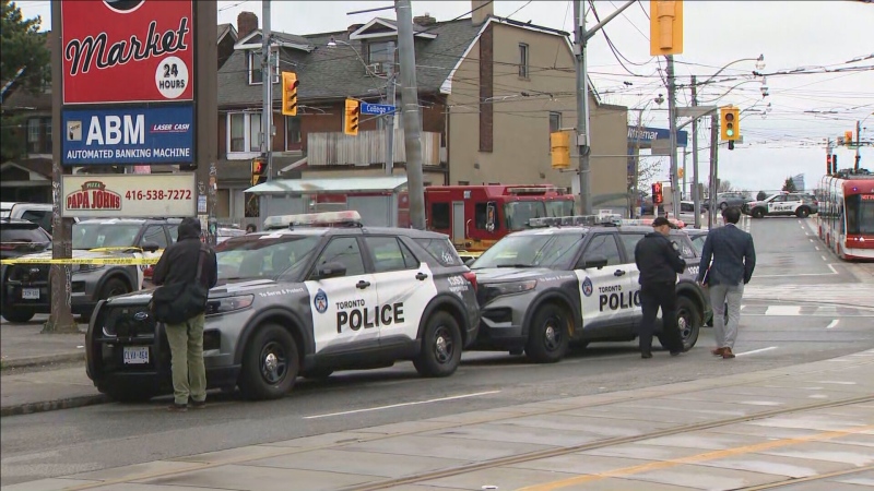 Police vehicles are shown at the scene of an incident near College Street and Lansdowne Avenue on Friday. Police say that an officer was stabbed and a suspect in that stabbing was shot. (CP24)