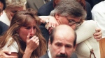 FILE - Fred Goldman, father of Ron Goldman, hugs his wife Patti, as his daughter, Kim, left, reacts during the reading of the not guilty verdicts in O.J. Simpson double-murder trial in Tuesday, Oct. 3,1995, in Los Angeles. (Myung J. Chun / Los Angeles Daily News via AP, Pool, File)