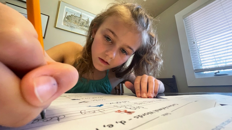 Grade 4 student Summer Paul, 10, is learning handwriting skills through a free program offered by the Bow Valley Calligraphy Guild. 