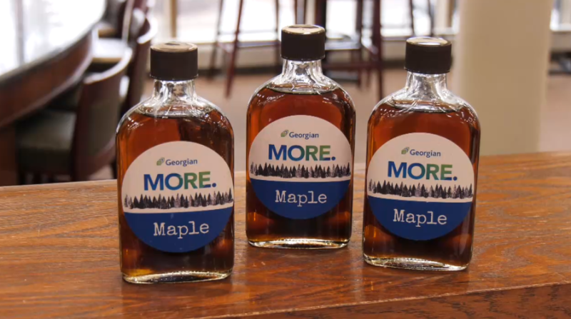 Three bottles of maple syrup produced at Georgian College in Barrie shown on Fri. April 12, 2024 (Chris Garry/CTV News Barrie). 