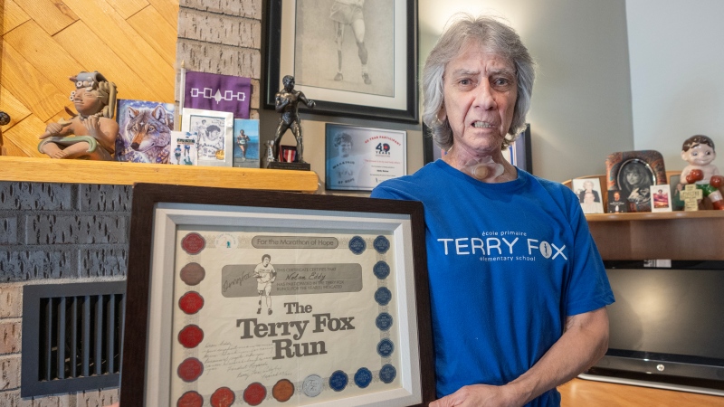Eddy Nolan, who has run in a Terry Fox marathon each year for 46 years, is seen with some of his memorabilia, in Montreal, Tuesday, April 9, 2024. (Ryan Remiorz, The Canadian Press)