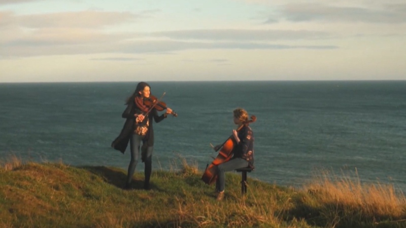 Jocelyn Pettit and Ellen Gira perform in their music video for "Across the Western Ocean." (Jocelyn Pettit)