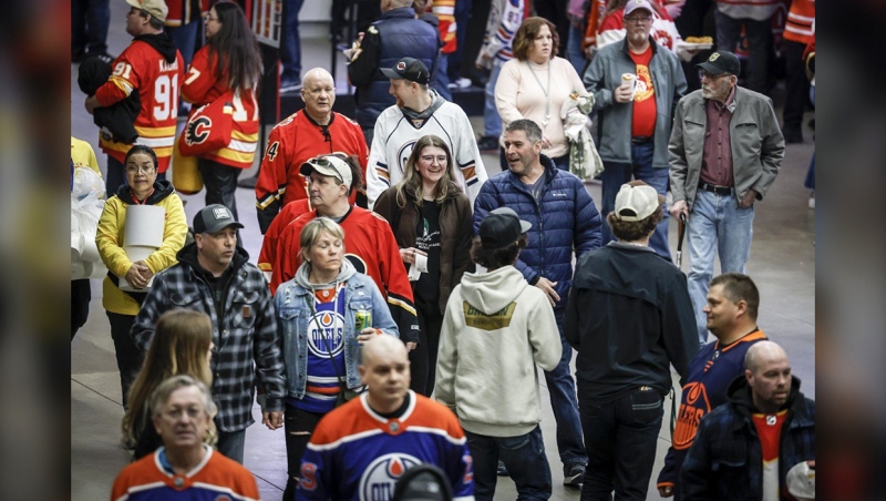 Crowds walk through the concourse before the start of a Calgary Flames game in Calgary, Saturday, April 6, 2024.THE CANADIAN PRESS/Jeff McIntosh
