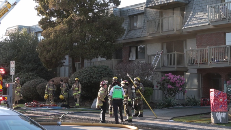 Firefighters are seen in front of an apartment building in Burnaby on Saturday, April 13. (CTV News/Pete Cline) 
