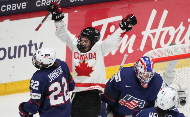 Canada's Danielle Serdachny (92) celebrates the goal by teammate Marie-Philip Poulin, not shown, over United States goaltender Aerin Frankel (31) during second period gold medal hockey action at the IIHF Women's World Hockey Championship in Utica, N.Y., Sunday, April 14, 2024. THE CANADIAN PRESS/Christinne Muschi
