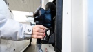 A woman gasses up at a gas station in Mississauga, Ont., Tuesday, Feb. 13, 2024. THE CANADIAN PRESS/Christopher Katsarov