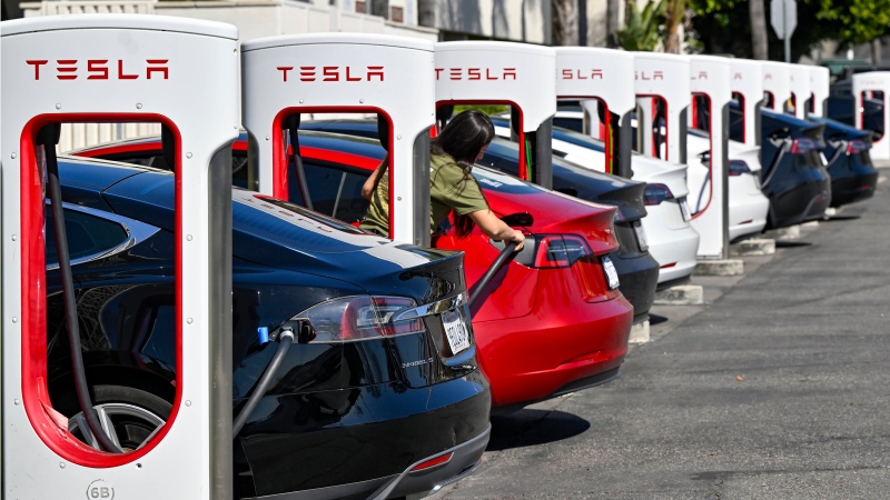 Drivers charge their Teslas in Santa Ana, Calif., on Wednesday, March 20, 2024. (Jeff Gritchen/The Orange County Register via AP)
