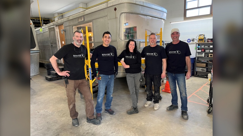 (From left:) Stu Pynoo, Gerardo Rojo, Maegan Clerihew, Shawn Pilgrim and Alain Hamonic make up the ReVolution Trailers restoration team. Since opening in 2019, Clerihew estimates they have kept between 350,000 to 400,000 pounds of RVs from ending up in the landfill. (Joseph Bernacki/CTV News Winnipeg)