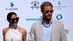 Prince Harry, right, and wife Meghan Markle, Duchess of Sussex, arrive for the 2024 Royal Salute Polo Challenge to Benefit Sentebale, April 12, 2024, in Wellington, Fla. (AP Photo/Rebecca Blackwell) 