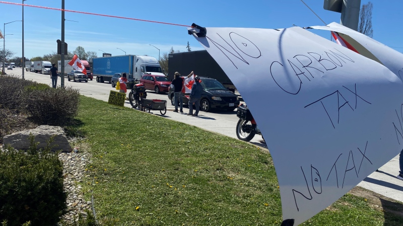 Rally on the sidewalk at Tecumseh Road West and Huron Church Road in Windsor, Ont., on Monday, April 15, 2024. (Ricardo Veneza/CTV News Windsor)