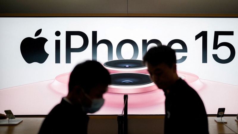 An Apple iPhone 15 advertisement is seen as it went on sale across China at an Apple Store in Shanghai, China September 22, 2023. (Aly Song / Reuters via CNN Newsource)