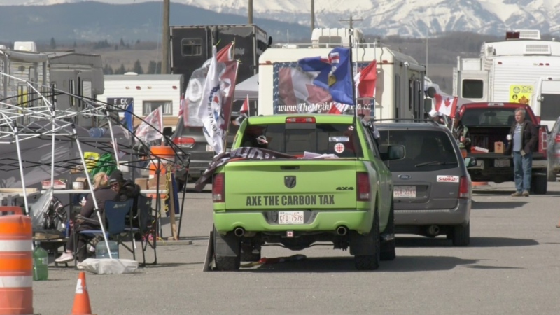 Hundreds of 'Axe the Tax' protesters have camped out on the side of Highway 1 near Cochrane for 15 days, since the federal tax increased on April 1.
