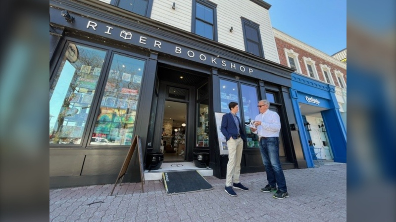 Coun. Linden Crain speaks with River Bookshop owner Richard Peddie in Amherstburg, Ont. on April 15, 2024. (Chris Campbell/CTV News Windsor) 