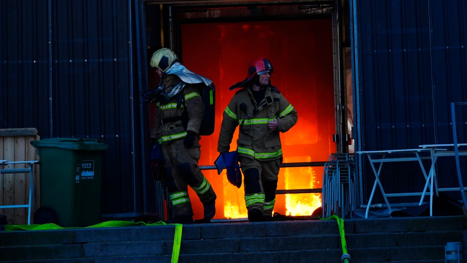 Denmark firefighters at Old stock exchange fire
