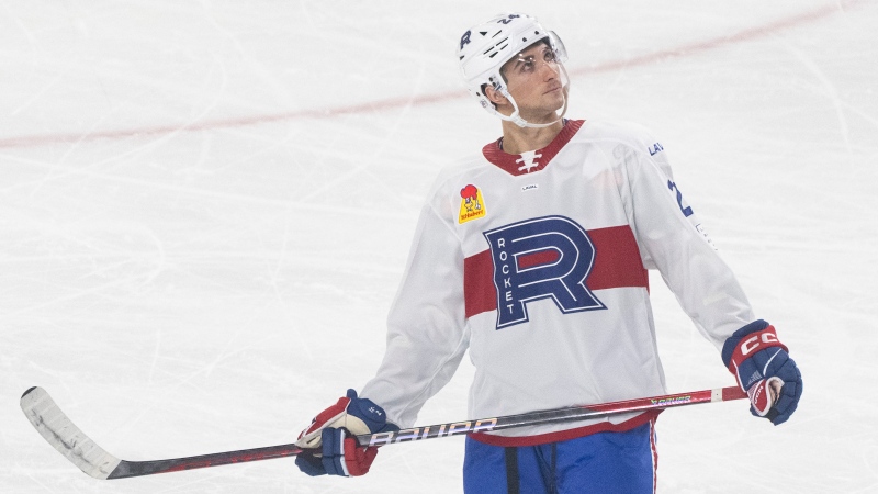 Laval Rocket's Logan Mailloux looks up at the scoreboard during AHL hockey action in Laval, Que., Friday Oct. 13, 2023. (THE CANADIAN PRESS/Christinne Muschi)