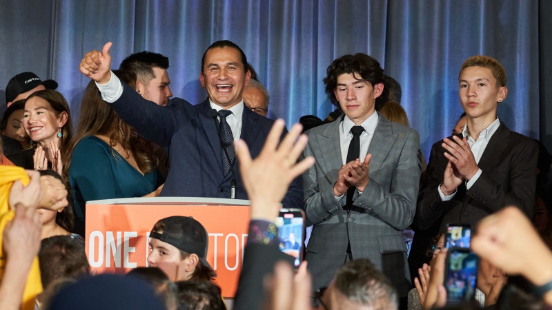 Manitoba NDP leader Wab Kinew delivers his victory speech surrounded by family after winning the Manitoba Provincial election in Winnipeg on Tuesday, October 3, 2023. THE CANADIAN PRESS/David Lipnowski
