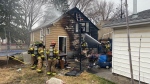 Edmonton firefighters on scene at a house fire near 113 Avenue and 84 Street. (Galen McDougall/CTV News Edmonton)