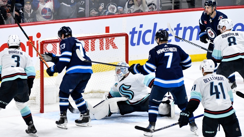Winnipeg Jets' Tyler Toffoli (73) scores on Seattle Kraken goaltender Philipp Grubauer (31) during the third period of NHL action in Winnipeg on Tuesday April 16, 2024. THE CANADIAN PRESS/Fred Greenslade