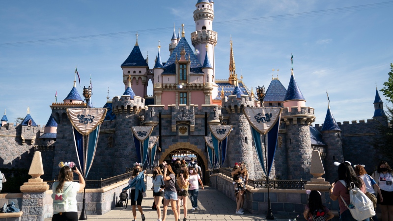 Visitors pass through Disneyland in Anaheim, Calif., on April 30, 2021. (AP Photo/Jae C. Hong, File) 