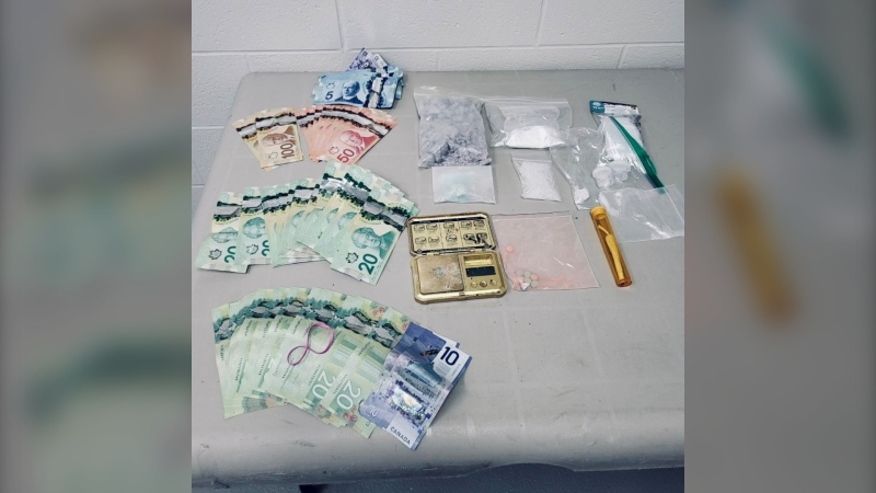 Ontario Provincial Police say officers seized $30,000 worth of drugs and $2,325 in cash during a traffic stop on Hwy. 417 in Hawkesbury. (OPP/X)