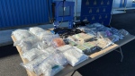 Drugs, cash, weapons and equipment seized by police. (Chilliwack RCMP handout)