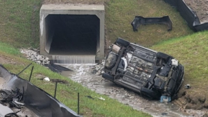 A vehicle rolled onto its side off Highway 400 at Essa Road in Barrie, Ont., on Tues., April 17, 2024. (Source: OPP) 