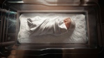 A stock photo of a baby in a hospital. (Unsplash/Jimmy Conover)