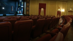 Red seats face a dimly lit stage at the Sanderson Centre in Brantford, ON. (Johnny Mazza/CTV News)