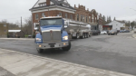 A transport truck travels through the community of Ayr, ON on April 17, 2024. (Jeff Pickel/CTV News)