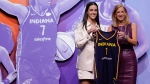 Iowa's Caitlin Clark, left, poses for a photo with WNBA commissioner Cathy Engelbert, right, after being selected first overall by the Indiana Fever during the first round of the WNBA basketball draft, Monday, April 15, 2024, in New York. (AP Photo / Adam Hunger)