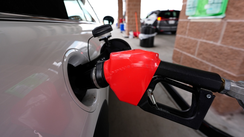 A car fills up gas. (THE ASSOCIATED PRESS/David Zalubowski)