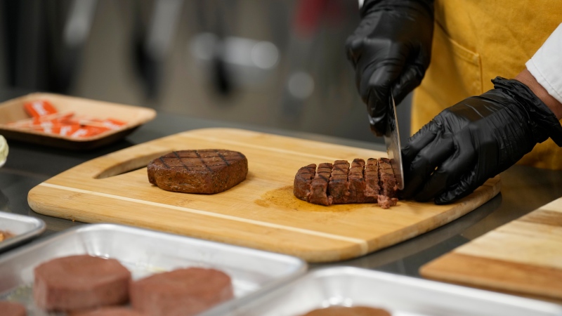 Plant-based steak product is cut up in a test kitchen in Boulder, Colo., on July 26, 2023. (THE CANADIAN PRESS/AP, David Zalubowski)