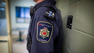 Patches are seen on the arm and shoulder of a corrections officer in the segregation unit at the Fraser Valley Institution for Women during a media tour, in Abbotsford, B.C., on Thursday October 26, 2017. THE CANADIAN PRESS/Darryl Dyck