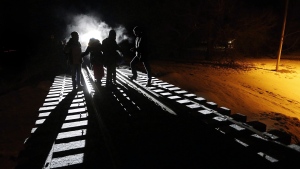 FILE: Migrants cross into Canada illegally from the United States. (John Woods / The Canadian Press)