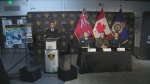 Police are shown at a news conference announcing the results of a multi-jurisdictional investigation into the grandparents scam. (CP24)