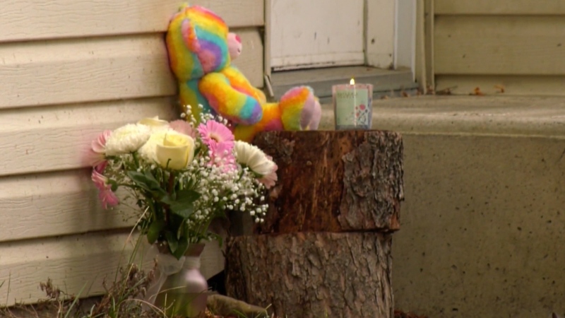 A memorial is seen outside the home where Olivia Hayden, 2, was found fatally injured on Sept. 29, 2022.