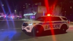 An Ottawa police vehicle is seen where police tape blocks off a section of road at York Street and Cumberland Street in the ByWard Market during a stabbing investigation on Wednesday evening, April 17, 2024. (CTV News Ottawa)