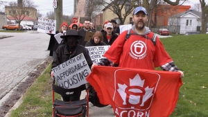 Members of London Acorn hold a mock funeral procession for affordable housing on April 18, 2024. (Daryl Newcombe/CTV News London)